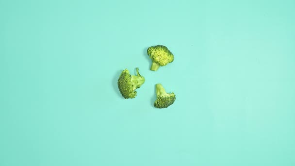 Creative Fresh Broccoli Make Pattern Cyan Background Stop Motion Flat — Video Stock