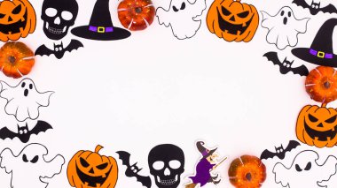 Creative Halloween frame made of various scary stickers on white background. Copy space flat lay