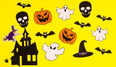 Halloween pattern with creepy stickers on yellow background. Flat lay. Autumn holidays concept