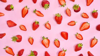 Delicious red strawberries fruits pattern on pastel pink background. Flat lay