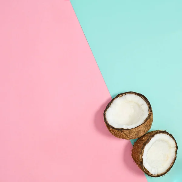 Half Sliced Coconut Pastel Pink Cyan Background Flat Lay Creative — Stockfoto