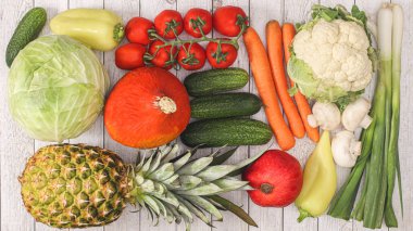 Fruit and vegetables on wooden background. Flat lay healthy food concept