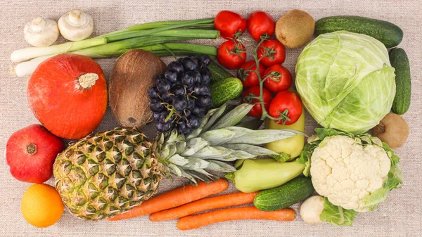 Table full with fresh organic fruits and vegetables. Healthy life and dieting concept. Flat lay