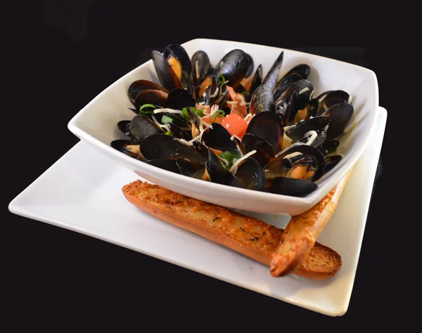 Gourmet steamed Mussels with bread sticks — Stock Photo, Image