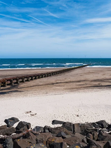 Cambois Beach Rocks Prevent Erosion Old Sewage Pipeline Wind Turbines — Stock Photo, Image