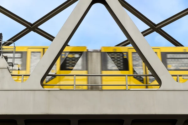 Yellow moving tram on a bridge in berlin — Stock Photo, Image