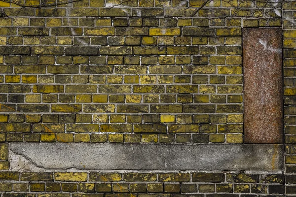 Antiguo fondo de pared de ladrillo amarillo con adornos — Foto de Stock