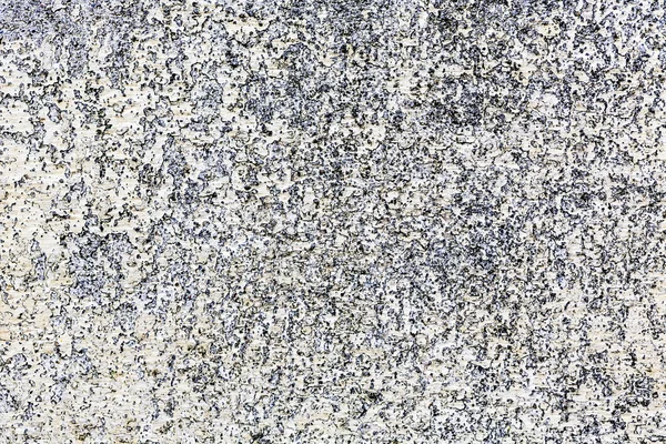 Natuursteen granieten muur met ruwe structuur — Stockfoto