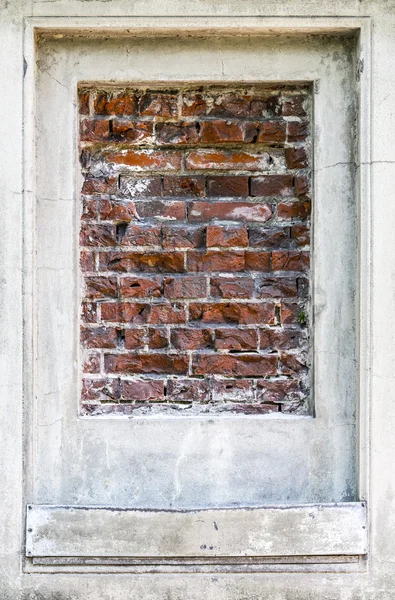 Old brick wall pattern closeup with stucco frame — Stock Photo, Image