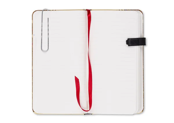 Blank page of note book with paper clip and elastic strap isolat — Stock Photo, Image