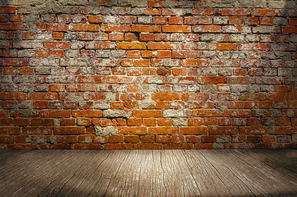 Indoor background with red brick wall an wooden plank floor — Stock Photo, Image