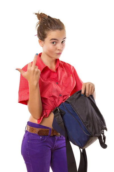 Angry teenage girl holding a bag and giving middle finger, isol — Stock Photo, Image