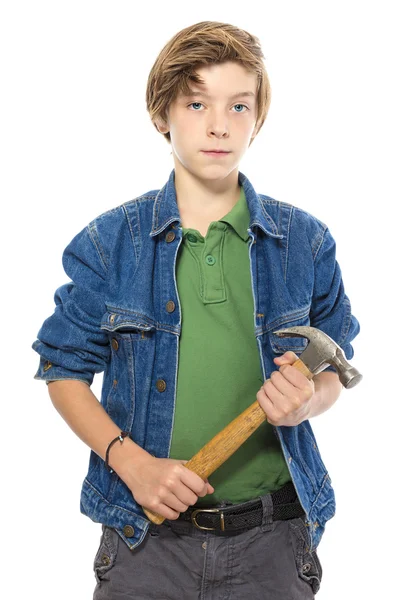 Confident teenage boy holding a hammer with both hands, isolated — Stock Photo, Image