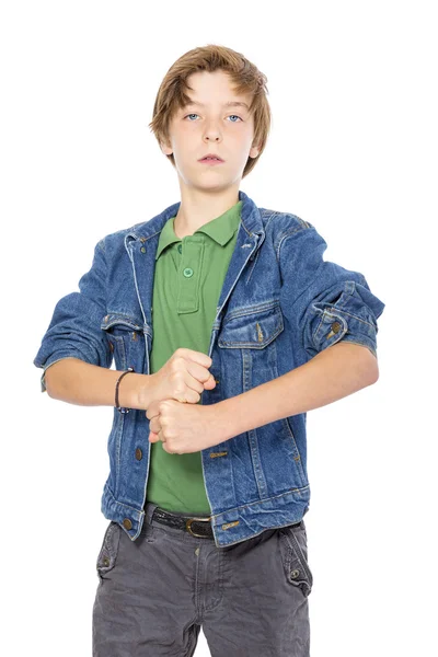 Proud teenage boy holding his fists in front, isolated on white — Stock Photo, Image