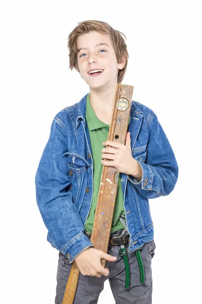 Laughing male teenager holding a water-level, isolated on white — Stock Photo, Image