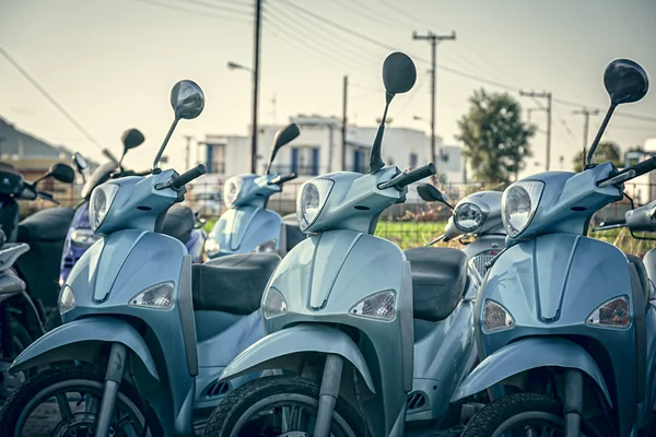 Some blue scooter in a row, shoot in greece — Stock Photo, Image