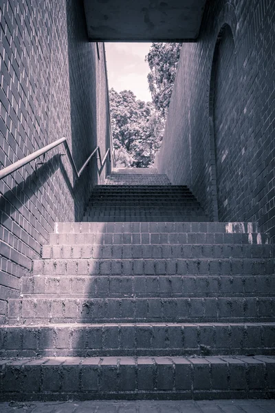 Vintage like photo from a stairway with red and handrail — Stock Photo, Image