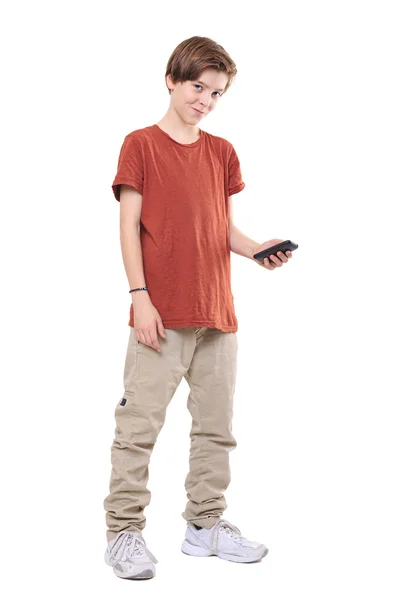 Male smiling teenager with mobile phone, isolated on white — Stock Photo, Image