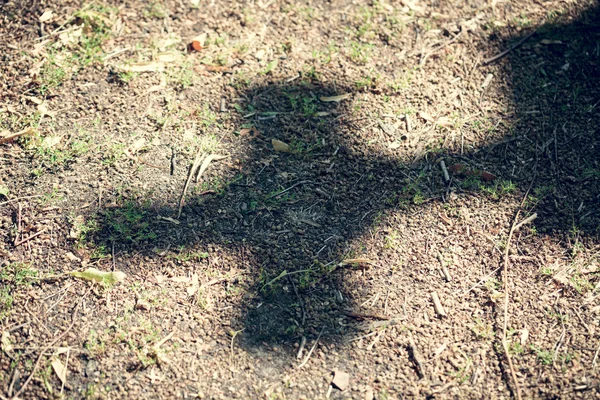 Shadow of a cross on dirty floor — Stock Photo, Image
