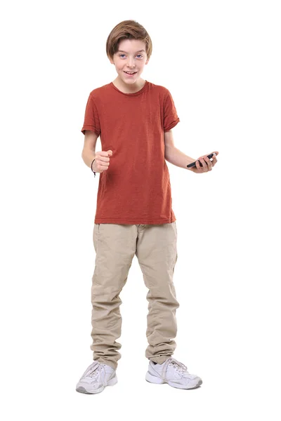 Smiling male teenager with smart phone in one hand, isolated on — Stock Photo, Image