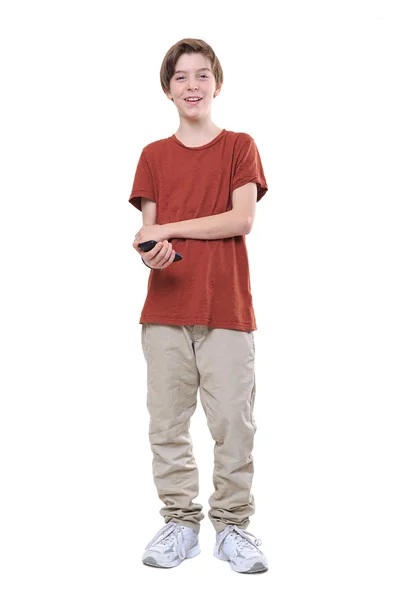 Laughing male teenager with smart phone in one hand, isolated on — Stock Photo, Image