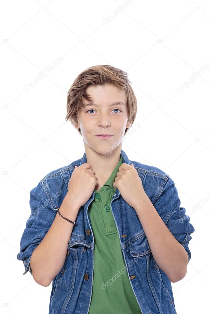 smiling male  teenager with hands on his jacked collar, isolated