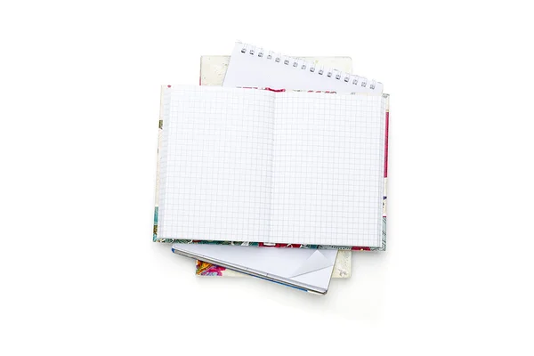 Stack of some open blank note pads and books, isolated on white — Stock Photo, Image