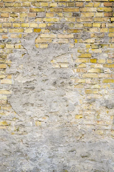 Primo piano di un vecchio grunge muro di mattoni gialli per sfondi — Foto Stock