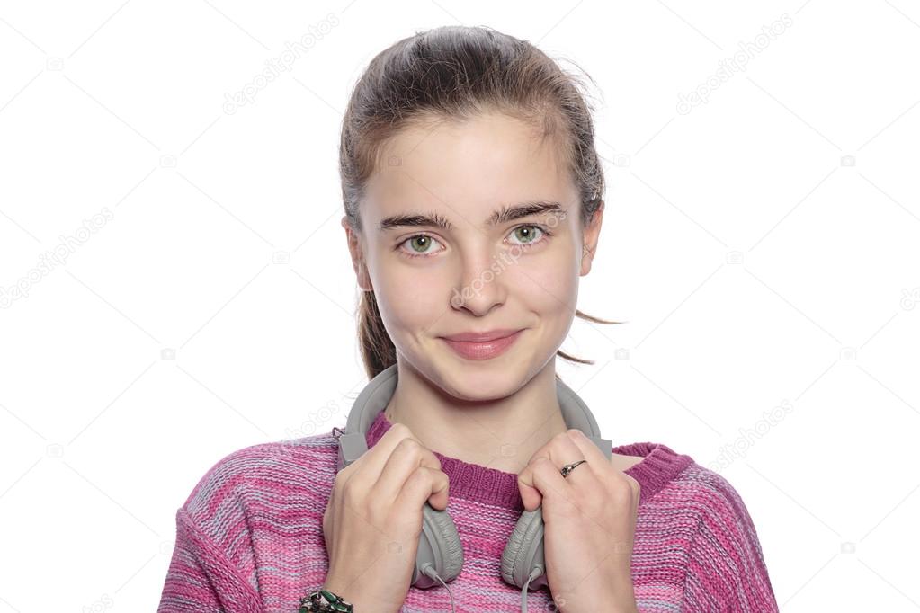 happy teenager girl with headphones, isolated on white