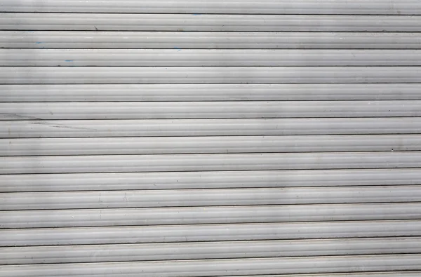 Dirty old roller shutter for backgrounds — Stock Photo, Image