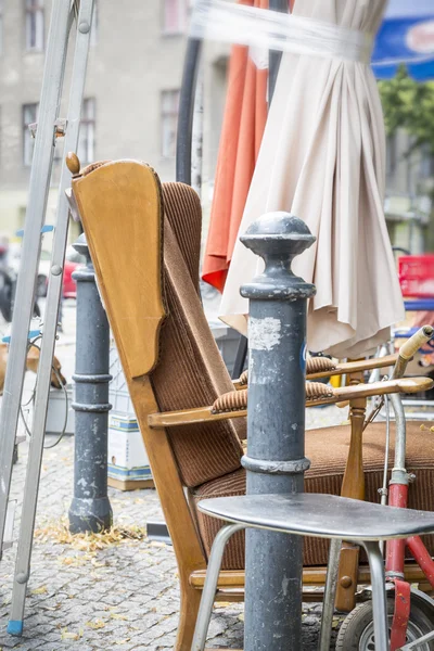 old arm chair and stuff on a flea market