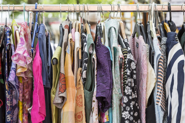 clothes on a rack on a flea market