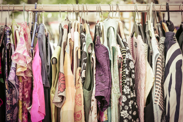 clothes on a rack on a flea market