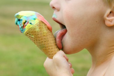 Child Licking Melting Ice Cream Cone clipart