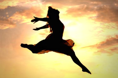 Woman Leaping at Sunset clipart