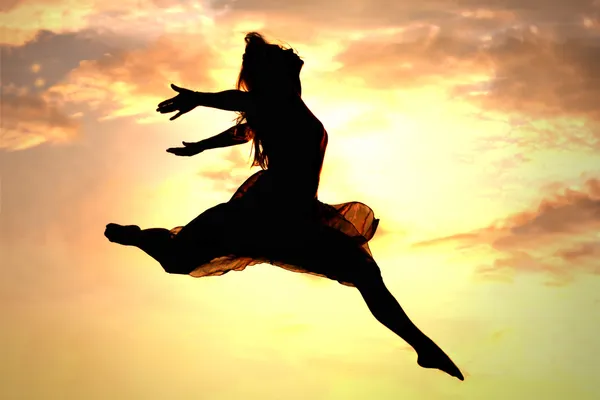 Woman Leaping at Sunset — Stock Photo, Image