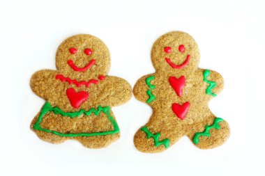 erkek ve kadın Noel gingerbread çerezleri üzerinde beyaz izole