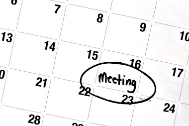 Word Meeting Written and Circled on Calendar clipart