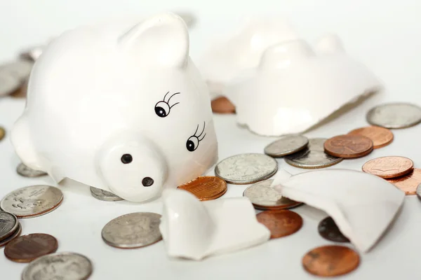 Broken Small Piggy Bank Surrounded by Spilled Coins — Stock Photo, Image