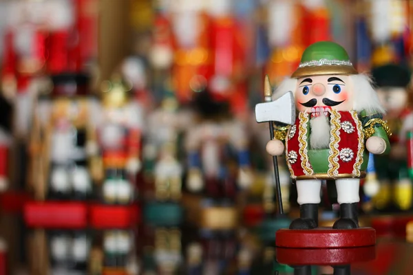 Christmas Nutcracker in front of Collection of Toy Soldiers — Stock Photo, Image