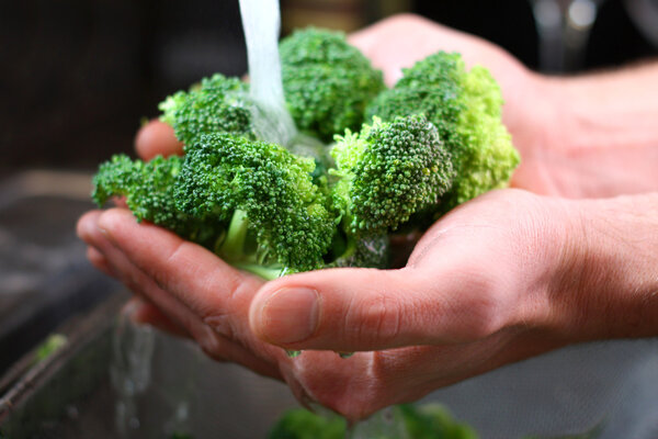 Man's Hands Washing Broccoli Vegetables in Kitchen Sink