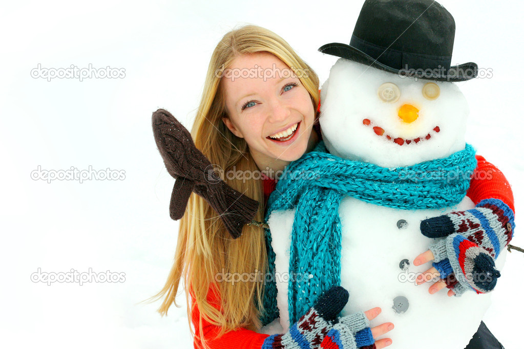 Woman and Snowman Outside in Winter