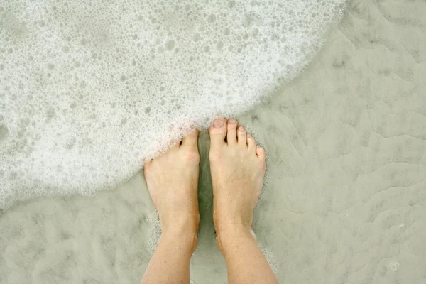 Woman 's Feet in Ocean on Beach — стоковое фото