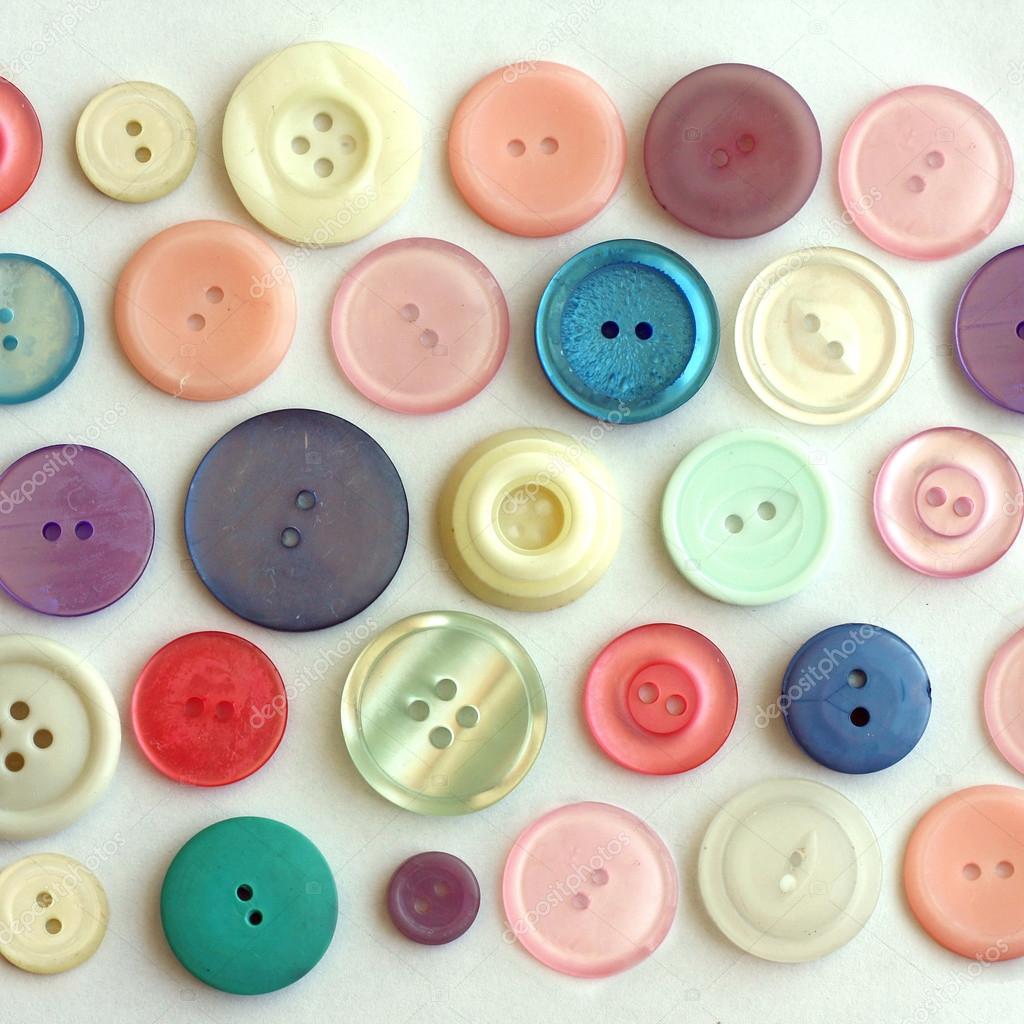 Pastel Colored Vintage Buttons on White Background
