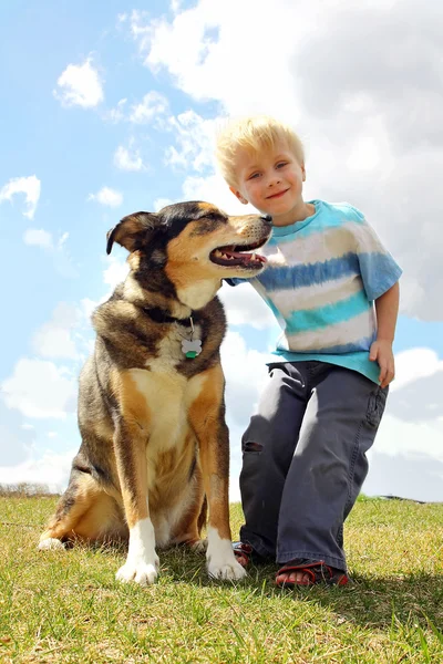 Happy Little Kid Outside with his Dog Royalty Free Stock Photos