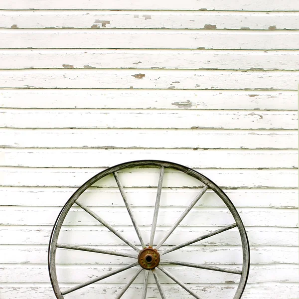 Antique Wooden Wagon Wheel on Rustic White Background — Stock Photo, Image