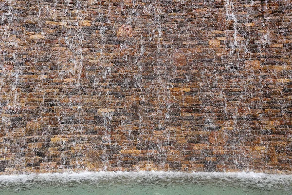 Stone Wall Has Water Falling Fountain — Stock Photo, Image