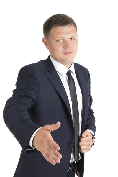Jovem homem de negócios oferecendo-lhe um aperto de mão — Fotografia de Stock