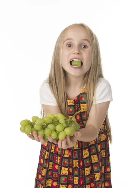 Girl in a beautiful dress with grapes — Stock Photo, Image