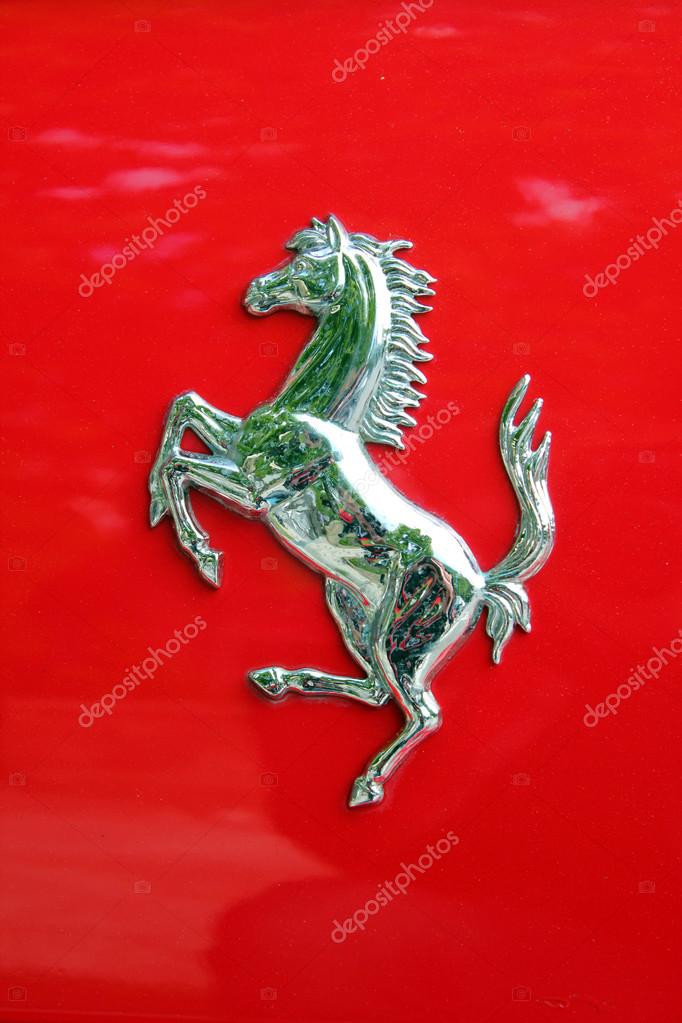 Ferrari logo on a red Ferrari car